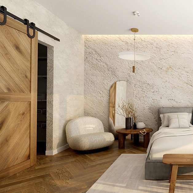 Drewniane drzwi przesuwne w sypialni urzadzonej w naturalnym stylu